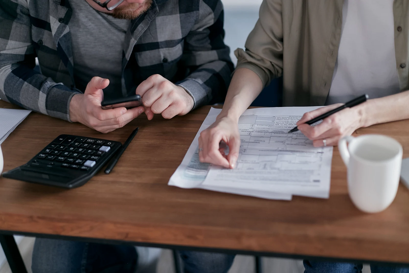 A couple reviewing mortgage documents together
